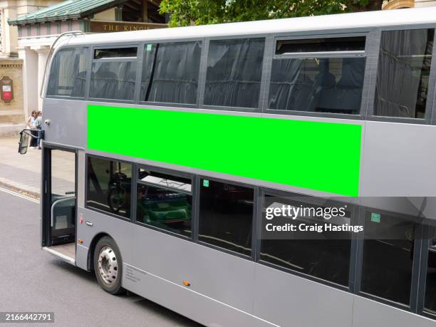close up of city center bus transport vehicle on street with green screen chroma key marketing advertisement billboard on side that can be replaced with marketing or ad agencies campaign content targeting adverts at consumers, retail shoppers, commuters - truck show stock pictures, royalty-free photos & images