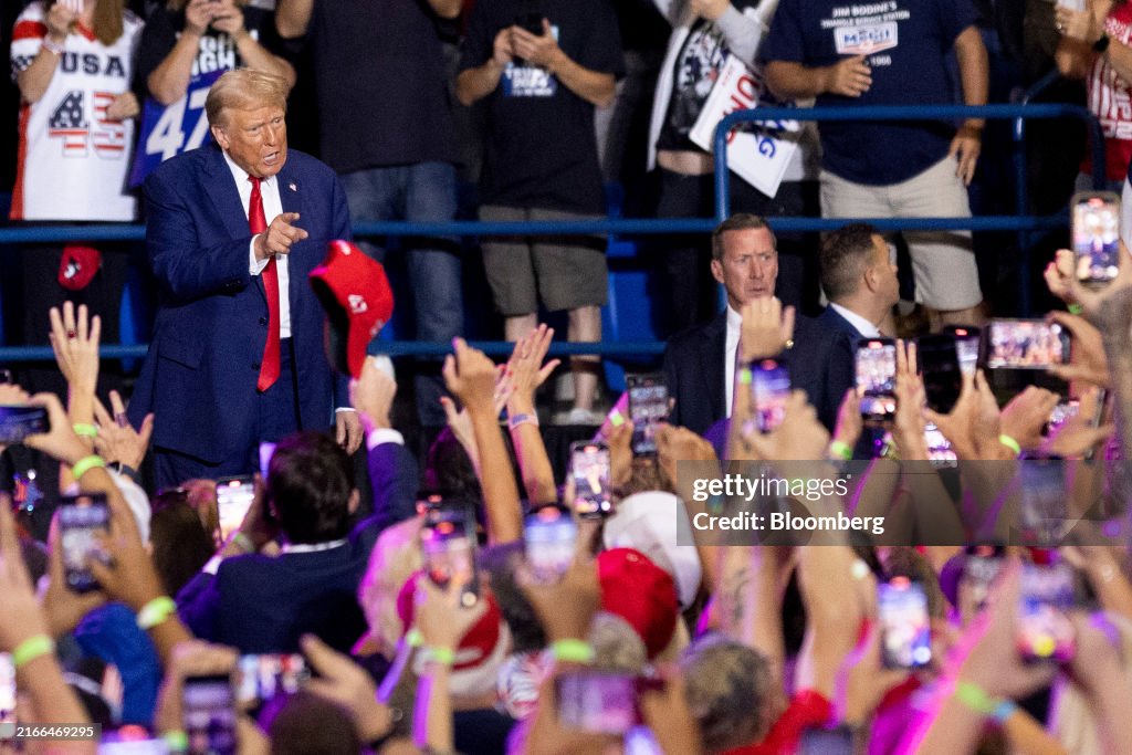 Former US President Donald Trump arrives for a campaign event in ...
