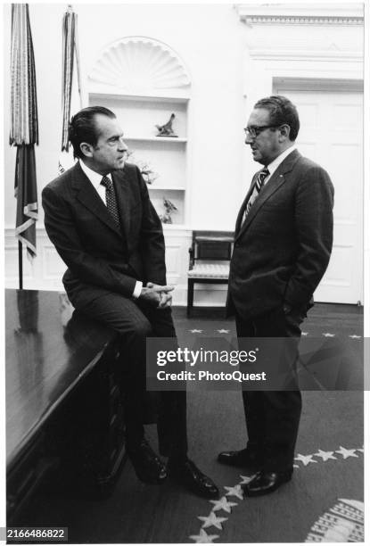 President Richard Nixon and National Security Advisor Dr Henry Kissinger talk together in the White House's Oval Office, Washington DC, February 8,...