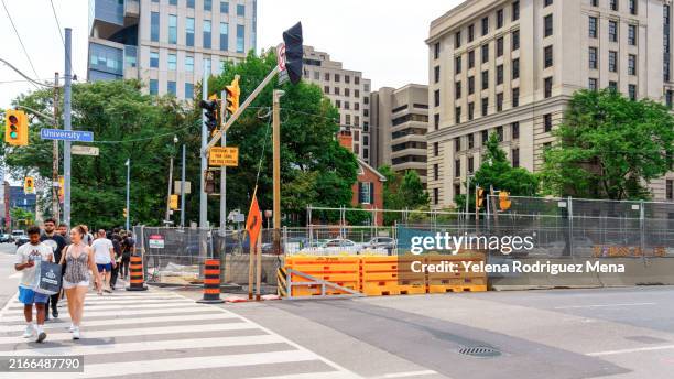 people crosswalk construction site - pedestrian stock pictures, royalty-free photos & images