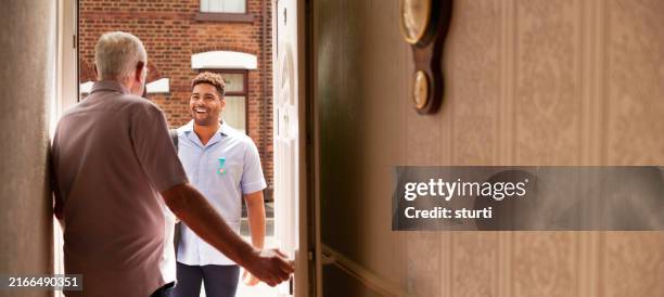 male care nurse house call - visit stock pictures, royalty-free photos & images