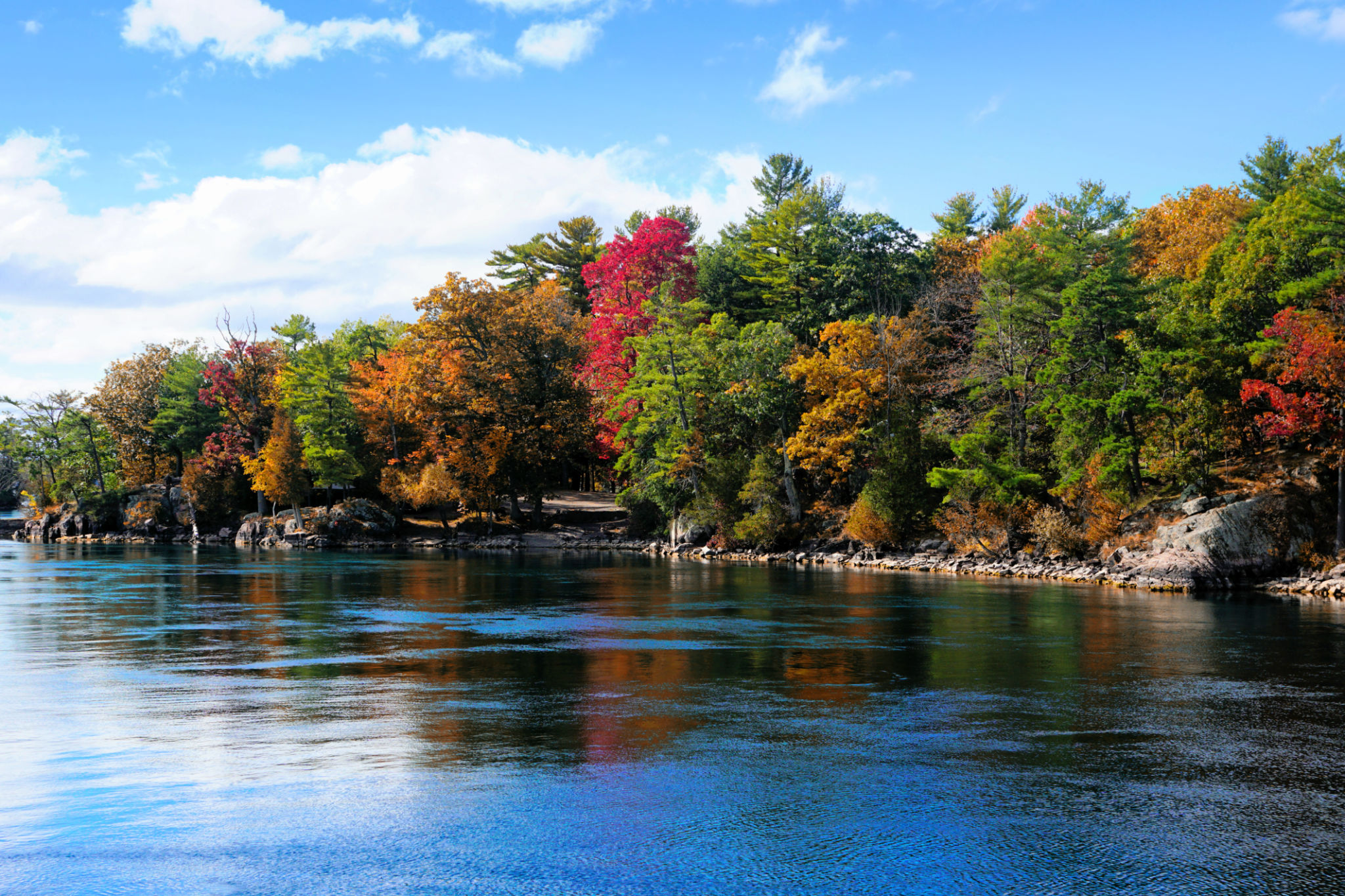 Thousand Islands along the Canada USA border during autumn with fall colors Thousand Islands along the Canada USA border during autumn with fall colors