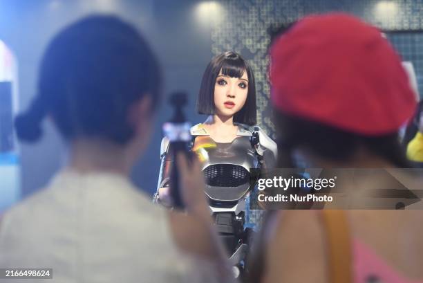 An intelligent bionic ''beauty'' robot is performing and interacting with citizens to answer questions at a shopping mall in Hangzhou, China, on...