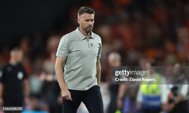 Rob Edwards, the Luton Town manager walks off the pitch at half time during the Sky Bet Championship match between Luton Town FC and Burnley FC at...