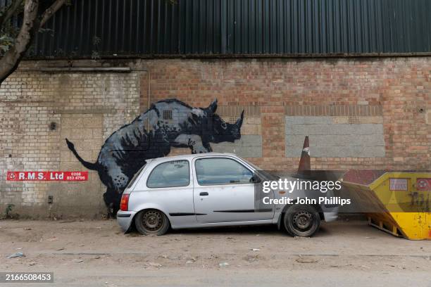 Painting of a rhinoceros purportedly by Banksy adorns a wall on August 12, 2024 in the Charlton area of London, England. Banksy, who claimed credit...