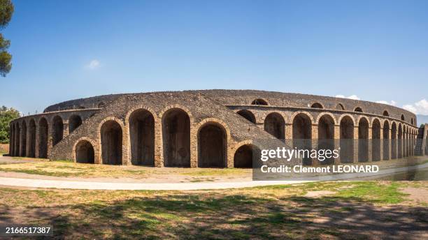 ruins of ancient roman amphitheatre of the archaeological site of pompeii, unesco world heritage site - naples - campania - mezzogiorno (south italy). - amphitheatre stock pictures, royalty-free photos & images