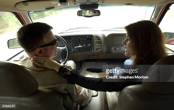 Tamara and Noel Nicolle share a private moment in their car before he deploys to Kuwait January 10, 2003 in Ft. Stewart, Georgia. Noel is a U.S. Army...