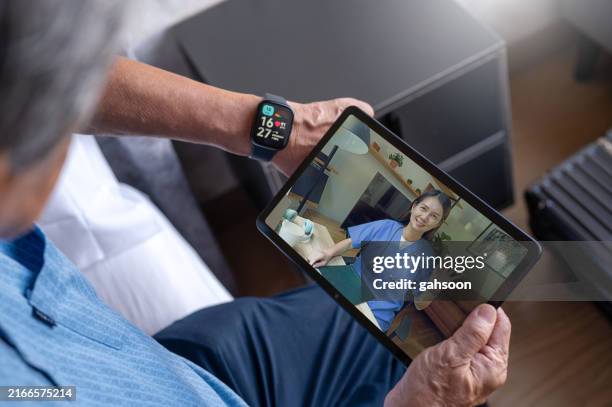 telemedicine at home using digital tablet - wearable computer stock pictures, royalty-free photos & images