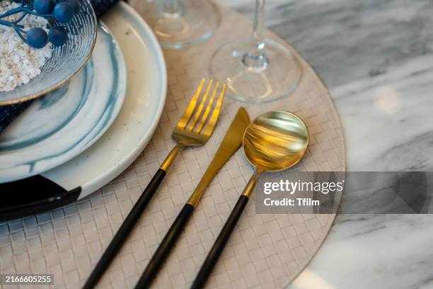 elegant table setting with gold flatware and marble plates - invitation stock pictures, royalty-free photos & images