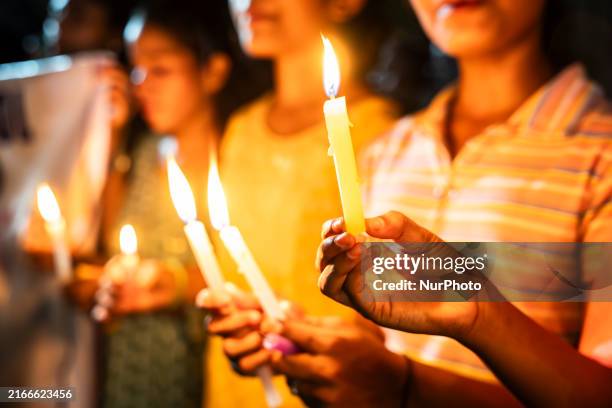 Students are lighting candles as they are paying tribute to a victim of rape and murder of a doctor inside a hospital in Kolkata, on August 18 in...