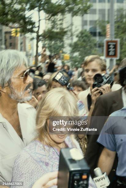 American actor and film director John Derek and his wife, American actress Bo Derek, attend a protest against Judge Henry Walker's film edit verdict,...