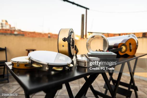 samba instruments on top of the table at rooftop - brazilian music stock pictures, royalty-free photos & images