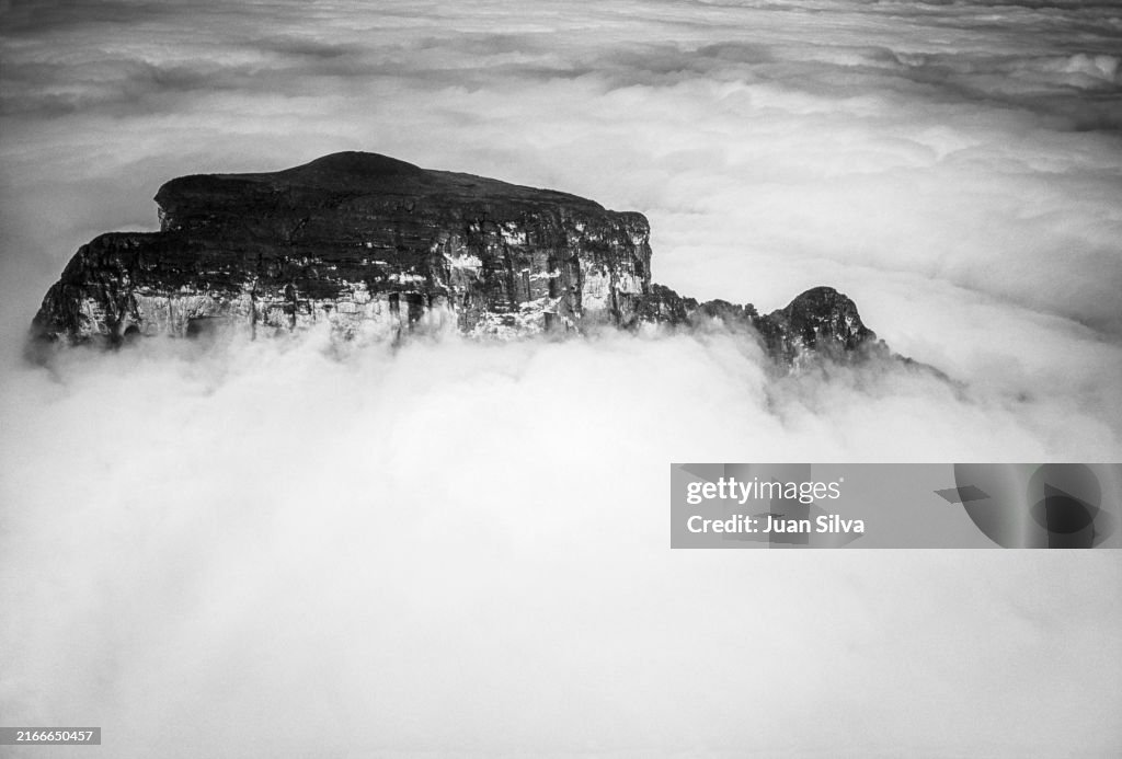 Aerial view of the Cerro Autana partially covered by clouds in the Amazonas State rain forest, Venezuela