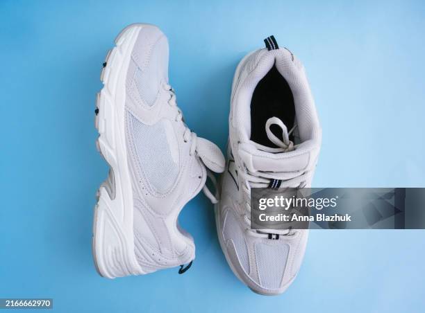 beige new clean sneakers close-up - zapato de tela fotografías e imágenes de stock