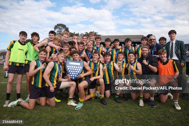 St Kevin's College celebrate with the shield after winning the Herald Sun Shield Inter Boys Div 1 Grand Final match between Western Heights College...