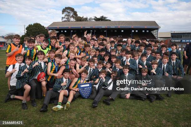 St Kevin's College celebrate with the shield after winning the Herald Sun Shield Inter Boys Div 1 Grand Final match between Western Heights College...