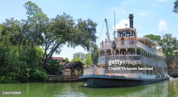 The riverboat Liberty Belle sailing on the Rivers of America passes Tom Sawyer Island at the Magic Kingdom in Walt Disney World on Aug. 15, 2024....