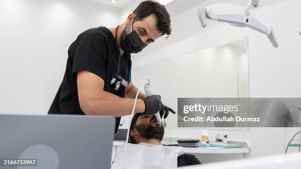 dentist man using 3d technology in clinic - 3d scanning stock pictures, royalty-free photos & images