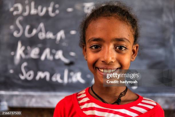 african little girl is learning amharic language - east africa stock pictures, royalty-free photos & images