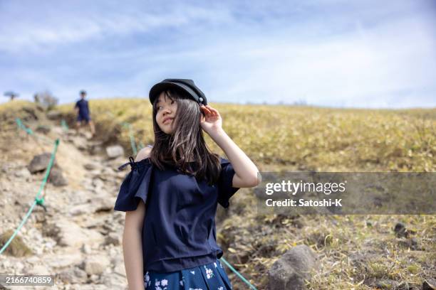 teenage girl tourist hiking on the hill - girl with cap stock pictures, royalty-free photos & images