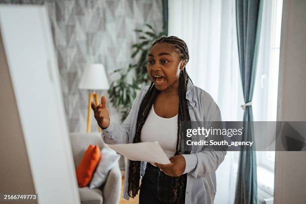 focused woman passionately practicing with paper notes - practicing speech stock pictures, royalty-free photos & images