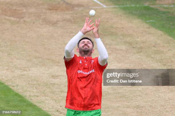 Ian Holland of Leicestershire catches Josh Shaw of Gloucestershire off his own bowling during the Metro Bank One Day Cup match between...