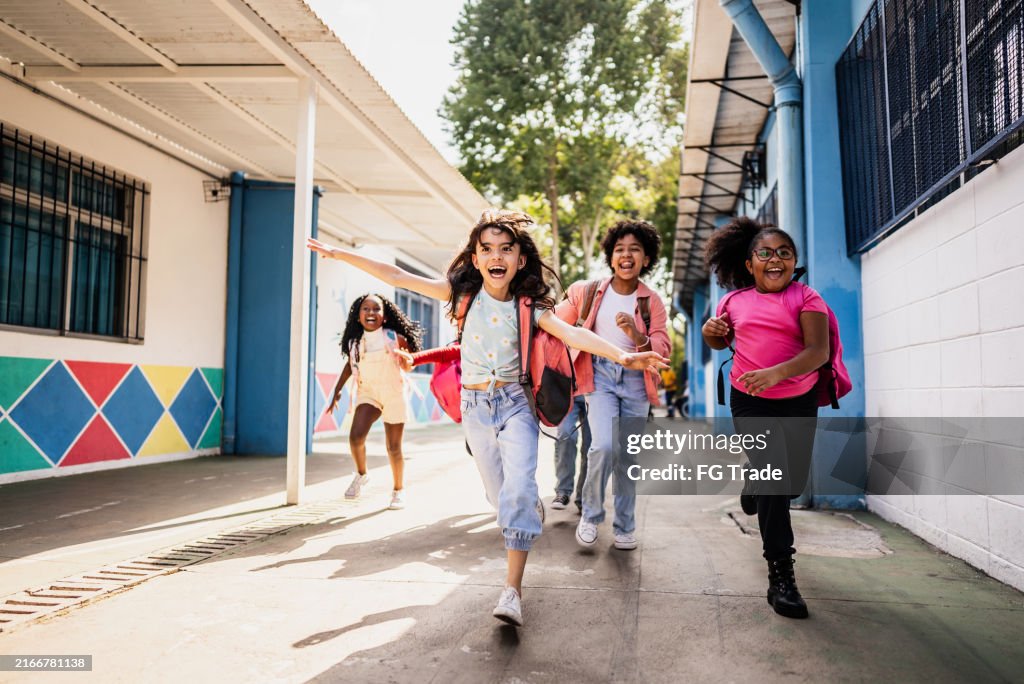 Students running on schoolyard