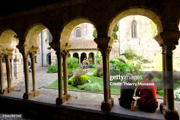 Tourists enjoy in the Cloitre Saint Salvy, part of the Collegiale Saint-Salvi of Albi on August 19 in Albi, Occitania, France.