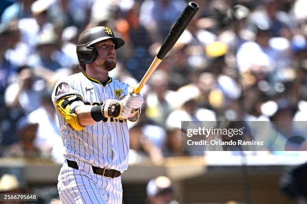 Jake Cronenworth of the San Diego Padres hits a three-run home run against the Pittsburgh Pirates during the first inning at Petco Park on August 14,...