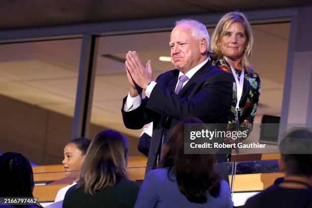 Democratic vice presidential nominee Minnesota Gov. Tim Walz gestures during the 2024 Democratic National Convention at United Center in Chicago on...
