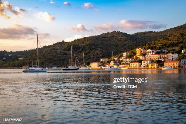 sunset over the harbor in vathi, greece - ionian sea stock pictures, royalty-free photos & images