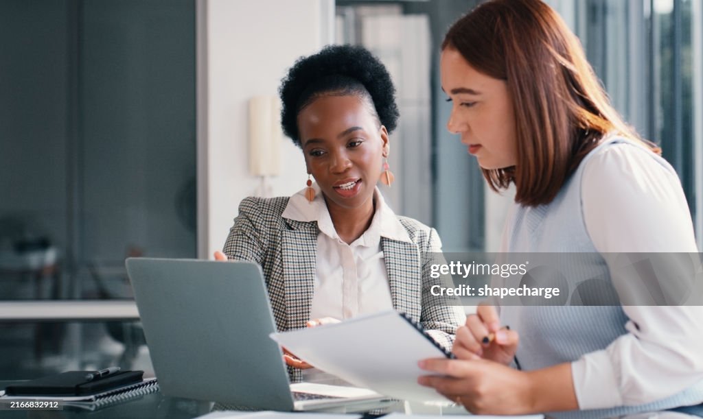 Paper, laptop and people in office for meeting, financial planning and business discussion. Women, document or tech at table for admin, budget review or audit information for company growth and taxes