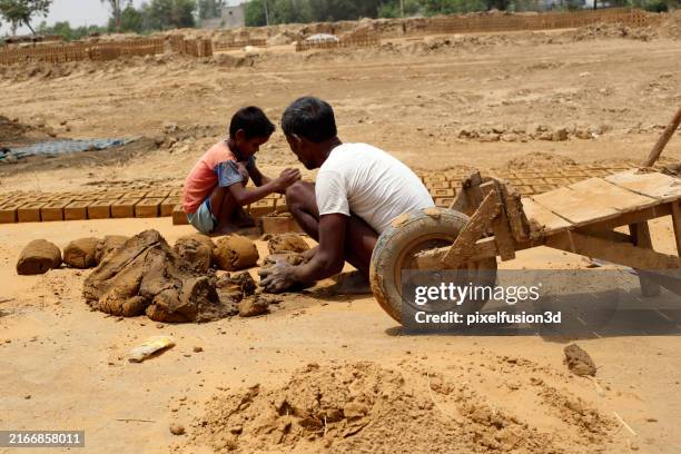 manual worker making brick - child labour stock pictures, royalty-free photos & images