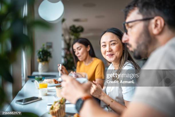 diverse office team lunch break - lunch break stock pictures, royalty-free photos & images