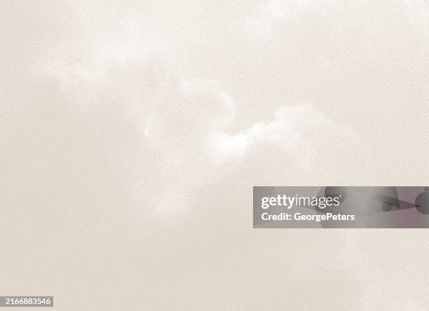 stipple illustration of cumulus clouds - sepia toned background stock illustrations