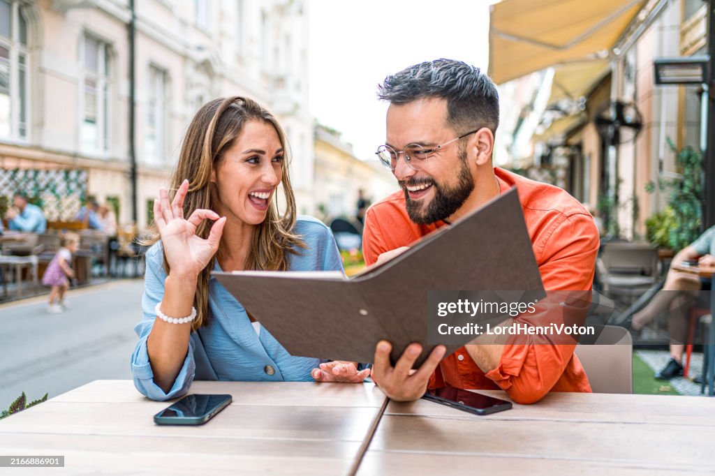 Couple discussing the menu in a restaurant