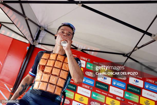 New overall ranking leader Team Bora's Primoz Roglic drinks and cool off after winning the stage 4 of La Vuelta a Espana cycling tour, a 170.4 km...