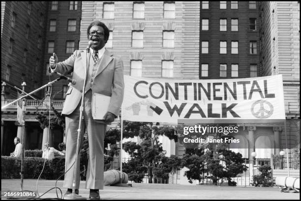 View of American religious & Civil Rights leader Reverend Ralph Abernathy as he speaks during the Continental Walk Rally in Union Square, San...