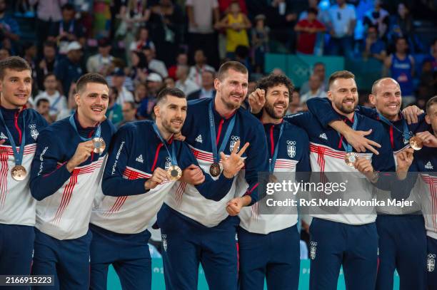 Team Serbia pose for photo with their bronze medals during the Men's Basketball Medal Ceremony on day fifteen of the Olympic Games Paris 2024 at...