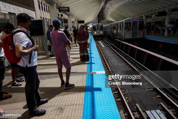 Passengers wait for a train during the Democratic National Convention in Chicago, Illinois, US, on Tuesday, Aug. 20, 2024. The Democratic National...