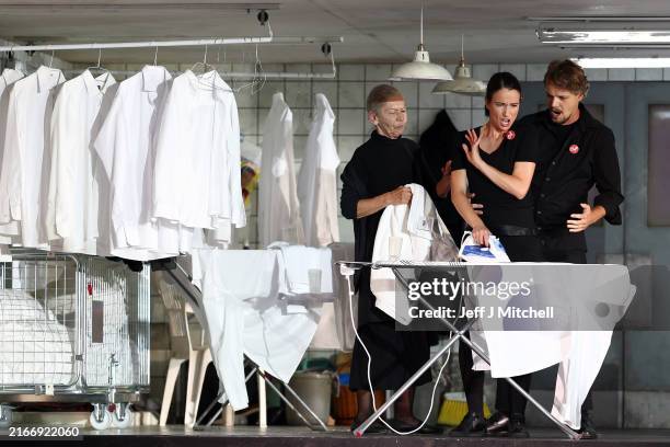 Opera singers perform during a dress rehearsal of "The Marriage of Figaro" by Komische Oper Berlin at the Edinburgh International Festival on August...
