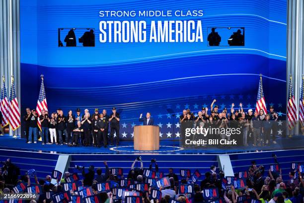 Sen. Gary Peters, D-Mich., flanked by Teamster Union members, speaks during day two of the 2024 Democratic National Convention in Chicago on Tuesday,...