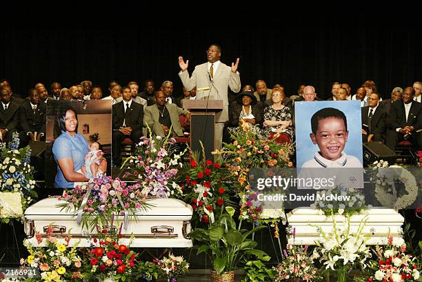 The Rev. Eddie L. Harper gives the eulogy at the funeral for five of his family members who were found shot to death in their home last week July 16,...