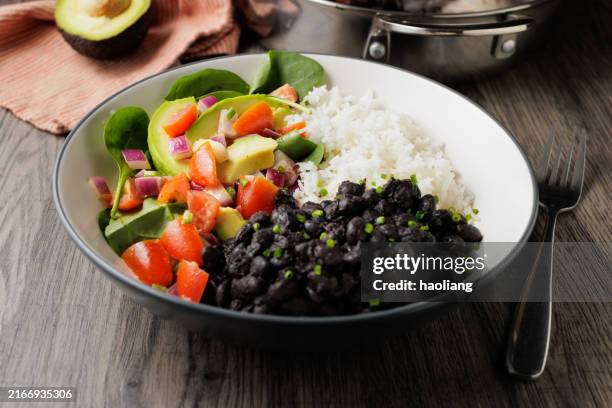 black beans rice bowl for vegan diet - cooked rice bowl stock pictures, royalty-free photos & images