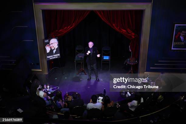 Magician David Parr performs a card trick at the Chicago Magic Lounge Wednesday, Aug. 14 in Chicago.