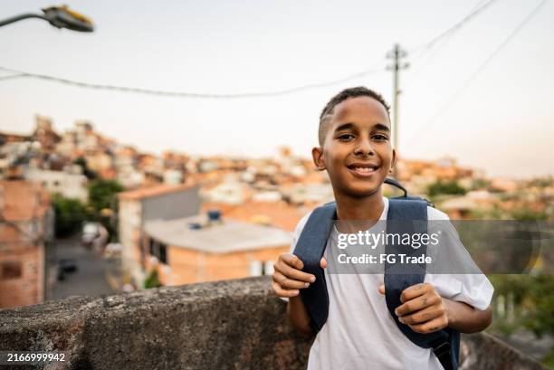 portrait of a child boy student in the favela - favela stock pictures, royalty-free photos & images