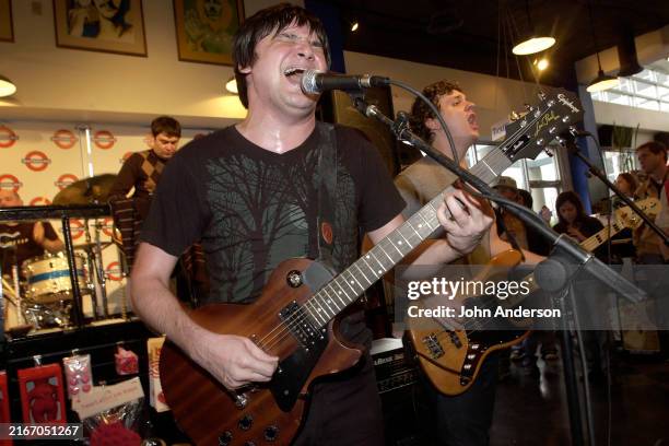 Rock musicians Conrad Keely , on electric guitar, and Jay Leo Phillips, on bass guitar, both of the group And You Will Know Us by the Trail of Dead,...
