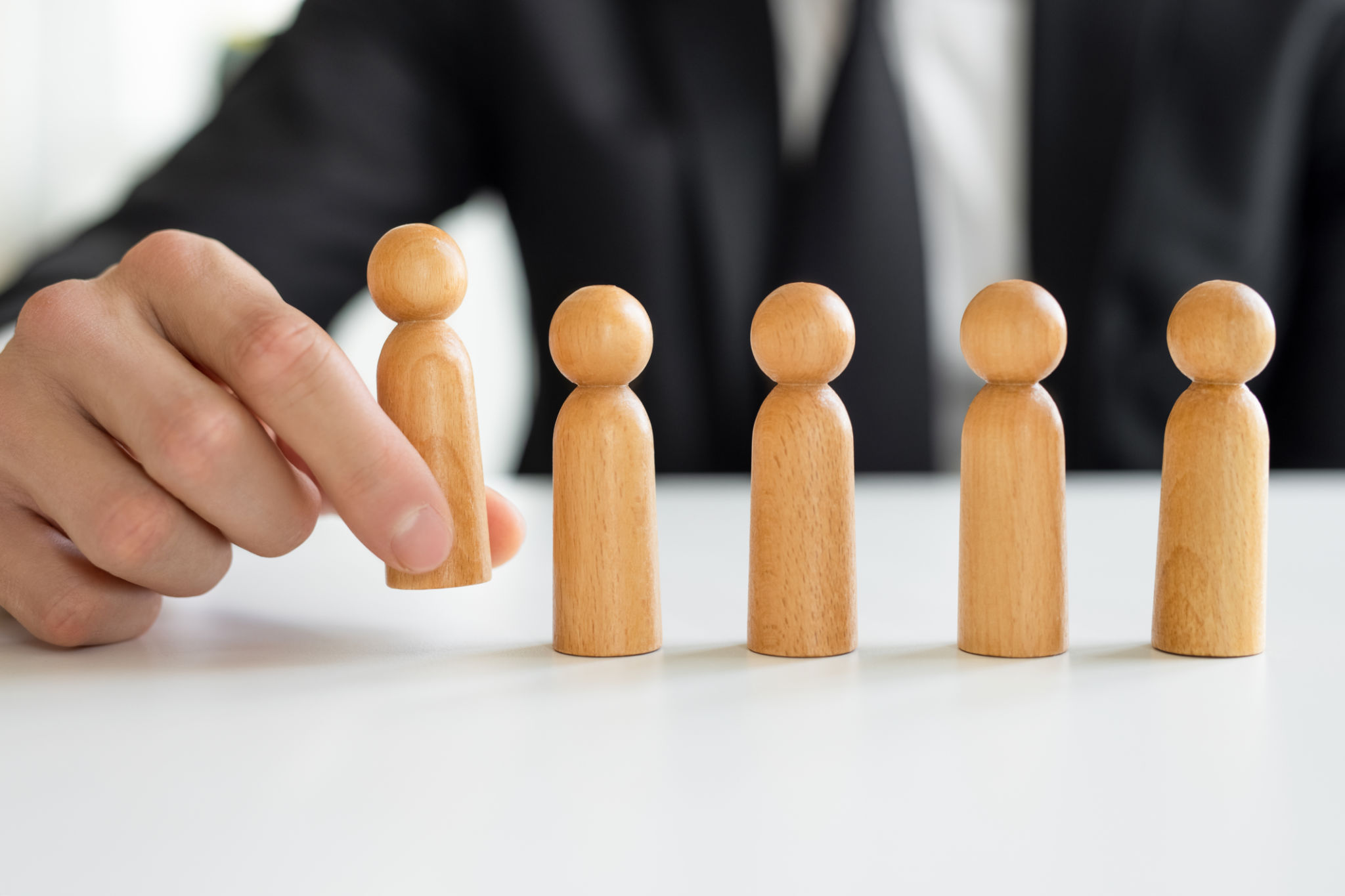 Hand holding chooses a leadership to success business Hand holding chooses a leadership to success business