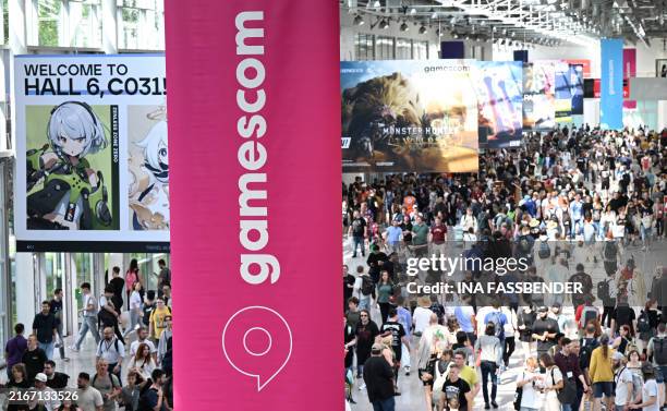 Photo shows visitors at the Gamescom video games trade fair in Cologne, western Germany on August 22, 2024. According to organisers, around 1400...