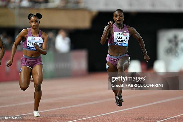Britain's Dina Asher-Smith competes in front of Jamaica's Tia Clayton to win the women's 100m event at the "Athletissima" Diamond League athletics...